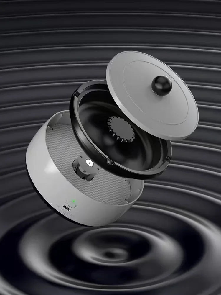 Scrumieră electrică modernă, automată, rotundă, pe fundal negru, mattale.ro